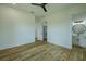 Bright bedroom shows ensuite bathroom, walk-in closet, beautiful wood floors, and modern design at 3515 Powerline Rd, Lithia, FL 33547