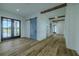 Hallway with wood floors and a decorative barn door at 3515 Powerline Rd, Lithia, FL 33547