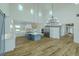 Bright open-concept kitchen and living space under a soaring ceiling with plenty of natural light at 3515 Powerline Rd, Lithia, FL 33547