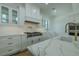 Close up of the kitchen with modern appliances, marble countertops, and stylish fixtures at 3515 Powerline Rd, Lithia, FL 33547