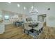Modern kitchen with an island, stainless steel appliances, and an open concept to the dining area at 3515 Powerline Rd, Lithia, FL 33547