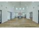 Open-concept living space with a chef's kitchen, hardwood floors, and abundant natural light at 3515 Powerline Rd, Lithia, FL 33547