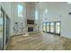 Bright living room boasts fireplace, built-in shelves, and large windows, perfect for entertaining guests at 3515 Powerline Rd, Lithia, FL 33547