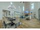 Spacious living room with high ceilings, a brick fireplace, and an open floor plan at 3515 Powerline Rd, Lithia, FL 33547