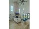 Spacious living room with a brick fireplace, built-in shelving, and lots of seating at 3515 Powerline Rd, Lithia, FL 33547