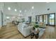 Open-concept living space with kitchen and dining areas, creating a great space for entertaining at 3515 Powerline Rd, Lithia, FL 33547