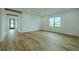 Spacious living room with wood-look floors and natural light at 3515 Powerline Rd, Lithia, FL 33547