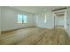Bright living room with lots of windows and wood flooring at 3515 Powerline Rd, Lithia, FL 33547