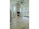 Bright living room featuring a brick fireplace, built-in shelves, and large windows, perfect for modern living at 3515 Powerline Rd, Lithia, FL 33547
