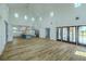 Bright open-concept living area featuring a modern kitchen and seamless indoor-outdoor flow to the lanai at 3515 Powerline Rd, Lithia, FL 33547
