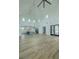 Spacious living room featuring high ceilings, a modern chandelier, and an open concept layout at 3515 Powerline Rd, Lithia, FL 33547
