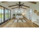 Spacious primary bedroom boasts vaulted ceilings with wood beams, large windows, and stylish decor at 3515 Powerline Rd, Lithia, FL 33547