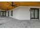 Inviting outdoor patio with dark-framed windows and wooden ceiling features, perfect for entertaining guests at 3515 Powerline Rd, Lithia, FL 33547