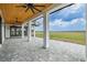 Picturesque outdoor patio offers stunning views, wood ceiling, and stately columns for relaxed, scenic outdoor living at 3515 Powerline Rd, Lithia, FL 33547