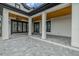 Spacious outdoor patio with white columns and wooden ceiling detail, providing a perfect spot for outdoor living at 3515 Powerline Rd, Lithia, FL 33547