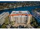 An aerial view of the condo building with a view of the water at 3805 Gulf Blvd # 504, St Pete Beach, FL 33706