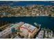 Stunning aerial view of waterfront homes along a tranquil bay, showcasing the coastal lifestyle at 3805 Gulf Blvd # 504, St Pete Beach, FL 33706
