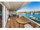 Large waterfront balcony with tile floors and ample space for dining and lounging with stunning views at 3805 Gulf Blvd # 504, St Pete Beach, FL 33706