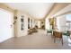 Spacious covered balcony with outdoor seating, perfect for enjoying the serene atmosphere at 3805 Gulf Blvd # 504, St Pete Beach, FL 33706