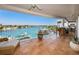 Spacious balcony with waterfront views and outdoor seating perfect for entertaining and relaxation at 3805 Gulf Blvd # 504, St Pete Beach, FL 33706