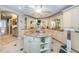 A luxurious bathroom boasts an island vanity, marble countertops, and custom cabinets at 3805 Gulf Blvd # 504, St Pete Beach, FL 33706