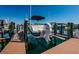 A boat lift showcases a boat with a Yamaha engine in a waterfront setting at 3805 Gulf Blvd # 504, St Pete Beach, FL 33706