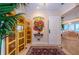 Inviting entryway with decorative screen, niche, and access to other living spaces at 3805 Gulf Blvd # 504, St Pete Beach, FL 33706