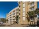 Multi-story condo building featuring balconies and subterranean parking at 3805 Gulf Blvd # 504, St Pete Beach, FL 33706