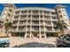 Beautiful building boasts multi-story balconies supported by white pillars at 3805 Gulf Blvd # 504, St Pete Beach, FL 33706