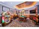 Entertaining game room complete with a jukebox, game table, and decorative lighting at 3805 Gulf Blvd # 504, St Pete Beach, FL 33706