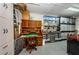 A workshop-style garage with epoxy flooring, tool storage, and an antique rolltop desk at 3805 Gulf Blvd # 504, St Pete Beach, FL 33706