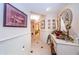 Elegant hallway with neutral paint, tiled floor, and decorative wall art at 3805 Gulf Blvd # 504, St Pete Beach, FL 33706