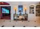 Hallway view looking into a custom home theater room with built-in shelving and decorative lighting at 3805 Gulf Blvd # 504, St Pete Beach, FL 33706