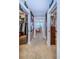 Hallway featuring closets with murals leading to the primary bedroom at 3805 Gulf Blvd # 504, St Pete Beach, FL 33706