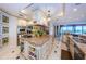 Luxury kitchen with an island, granite countertops, built-in appliances, and a wine rack, ideal for entertaining at 3805 Gulf Blvd # 504, St Pete Beach, FL 33706
