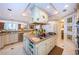 Large kitchen island with built-in sink and storage provides a functional space for food prep and entertaining at 3805 Gulf Blvd # 504, St Pete Beach, FL 33706