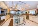 Elegant kitchen boasts professional stainless appliances, a spacious island, and ample storage, perfect for the home chef at 3805 Gulf Blvd # 504, St Pete Beach, FL 33706
