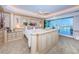 Well lit main bedroom features water views and decorative columns in the headboard design at 3805 Gulf Blvd # 504, St Pete Beach, FL 33706