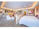Spacious main bedroom featuring sitting area, custom built-ins, and plush carpet throughout at 3805 Gulf Blvd # 504, St Pete Beach, FL 33706