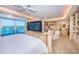 Bright main bedroom with sitting area, balcony access, and custom built-ins at 3805 Gulf Blvd # 504, St Pete Beach, FL 33706