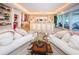 A stunning main bedroom featuring an expansive layout, balcony access, and seating area at 3805 Gulf Blvd # 504, St Pete Beach, FL 33706
