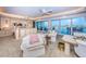 Spacious main bedroom with balcony access, luxurious furnishings, and serene water views at 3805 Gulf Blvd # 504, St Pete Beach, FL 33706