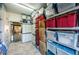 Organized storage room featuring shelves filled with storage containers and closet area at 3805 Gulf Blvd # 504, St Pete Beach, FL 33706