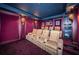 Movie theater room with comfortable seating, custom lighting, and state-of-the-art audio-visual setup at 3805 Gulf Blvd # 504, St Pete Beach, FL 33706