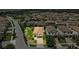 Aerial view of a single-Gathering home with lush landscaping in a suburban neighborhood at 3877 Burdick Loop, Odessa, FL 33556