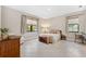 Spacious bedroom with neutral decor, two windows, and tiled floors at 3877 Burdick Loop, Odessa, FL 33556