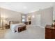 Bright bedroom with tiled floors and attached ensuite bathroom at 3877 Burdick Loop, Odessa, FL 33556