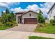 Charming single-story home with a beautiful paver driveway and manicured landscaping at 3877 Burdick Loop, Odessa, FL 33556