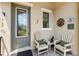 Cozy front porch with seating and decorative accents, creating a welcoming entrance at 3877 Burdick Loop, Odessa, FL 33556
