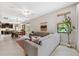 Bright, open-concept living space with kitchen and dining areas at 3877 Burdick Loop, Odessa, FL 33556